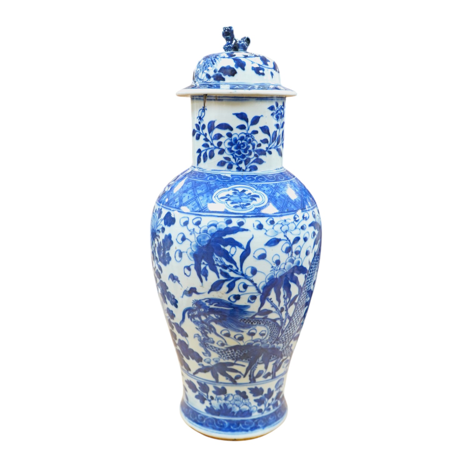 An early 20th century Chinese blue and white dragon vase and cover, 42cm high. Condition - crack and chip from rim of vase down the neck